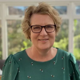 Head and shoulders photo of woman smiling