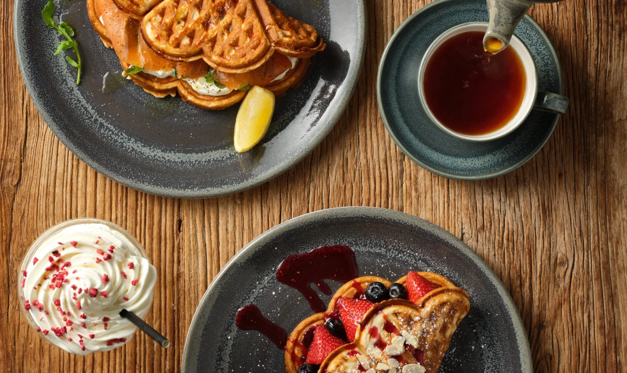 Image of a freshly-made waffle with red fruit berries