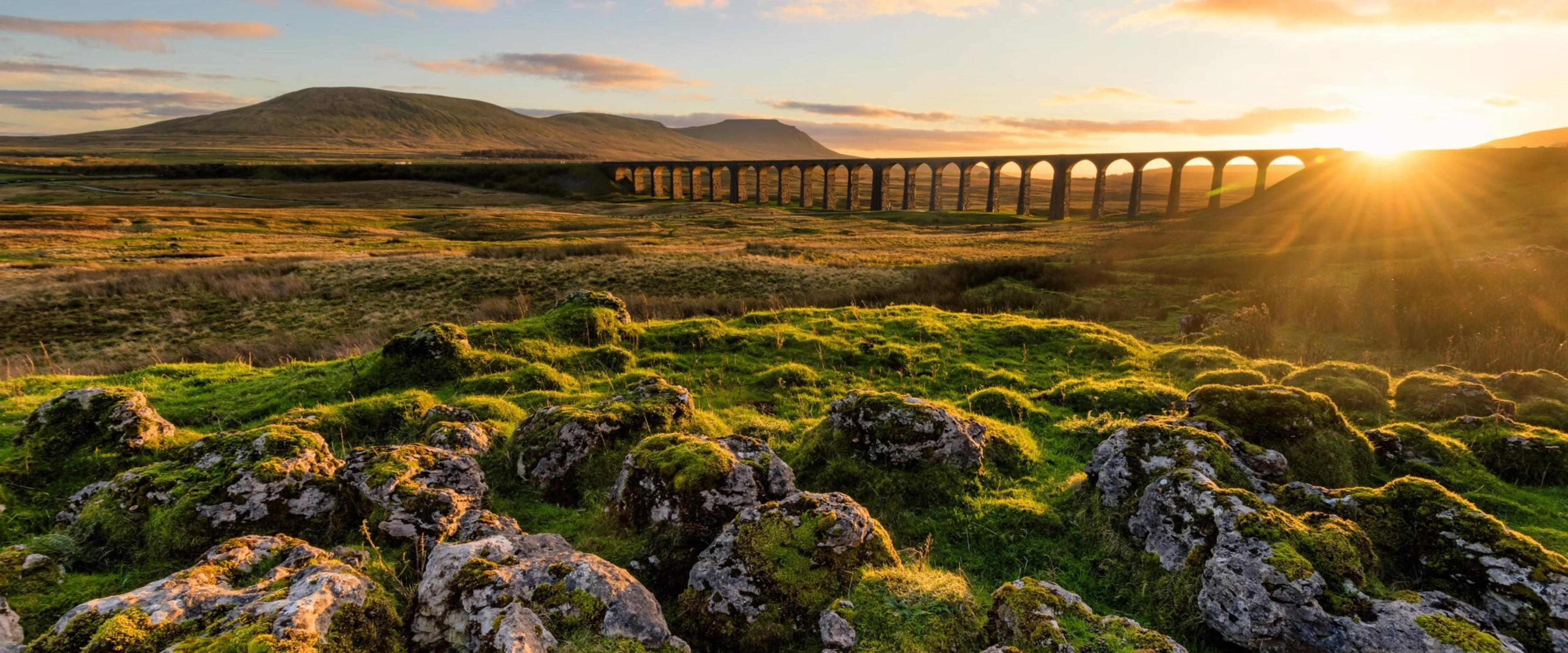 Photograph of a Yorkshire landscape with a viaduct and open country side at sunrise