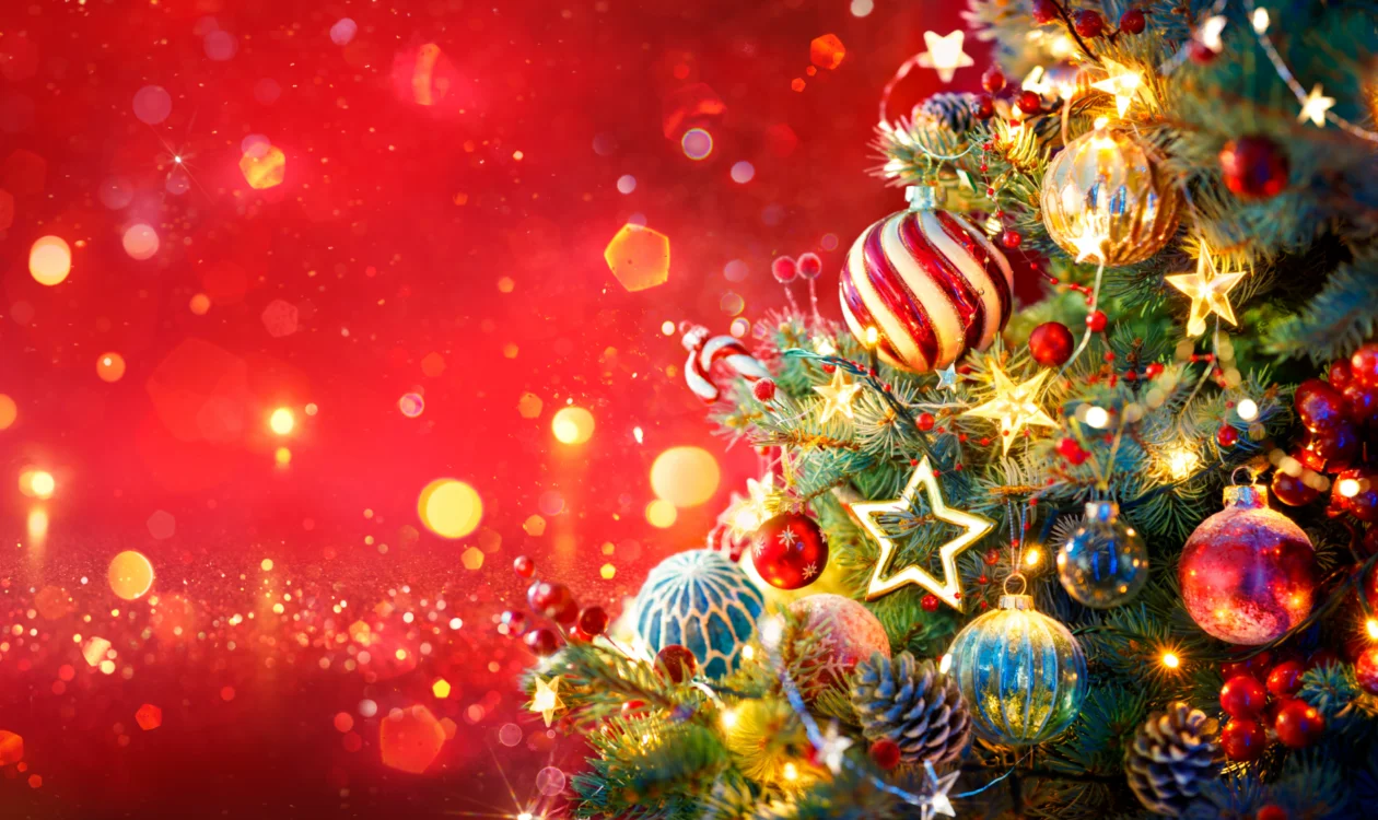 Image of a decorated Christmas Tree on a red background