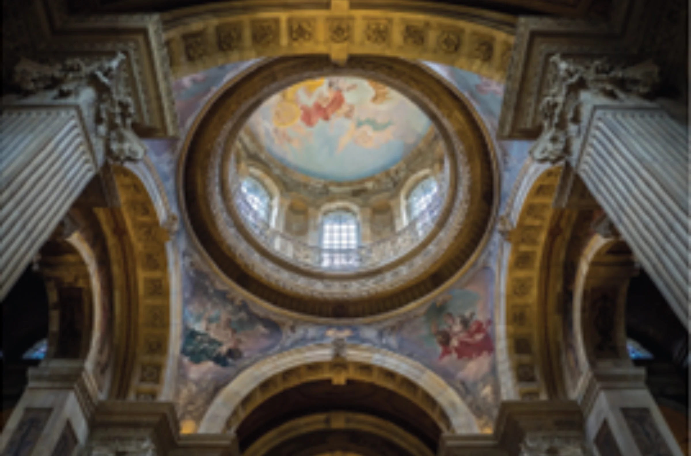 A grand feature ceiling from inside a stately home